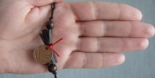 novčani amulet od šamana